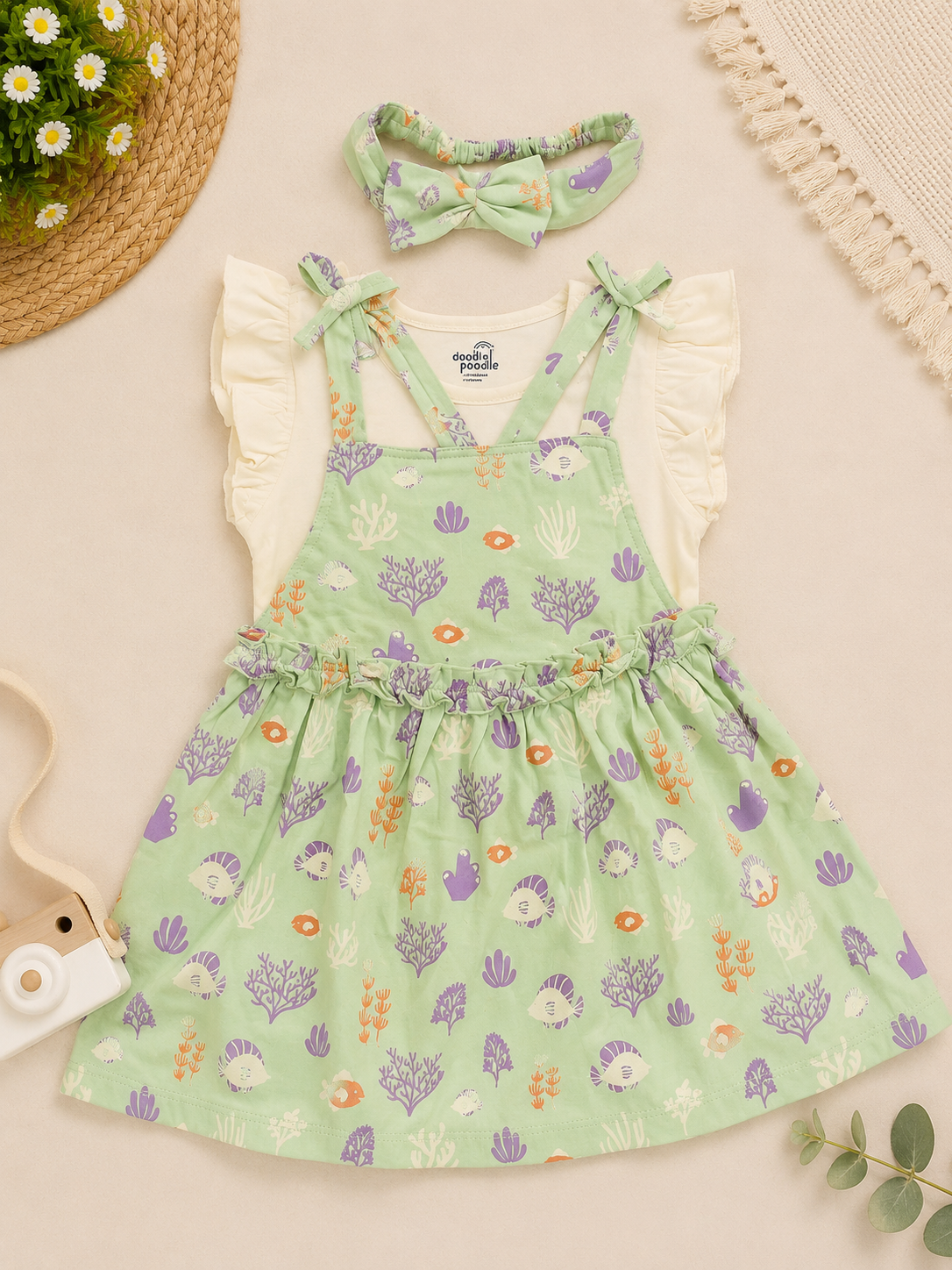 White Sleeveless T-Shirt and Pastel Green Tunic