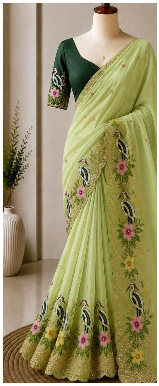 Pistachio Green Fancy Embroidered Saree with Heavy Work Border and Unstitched Contrast Blouse
